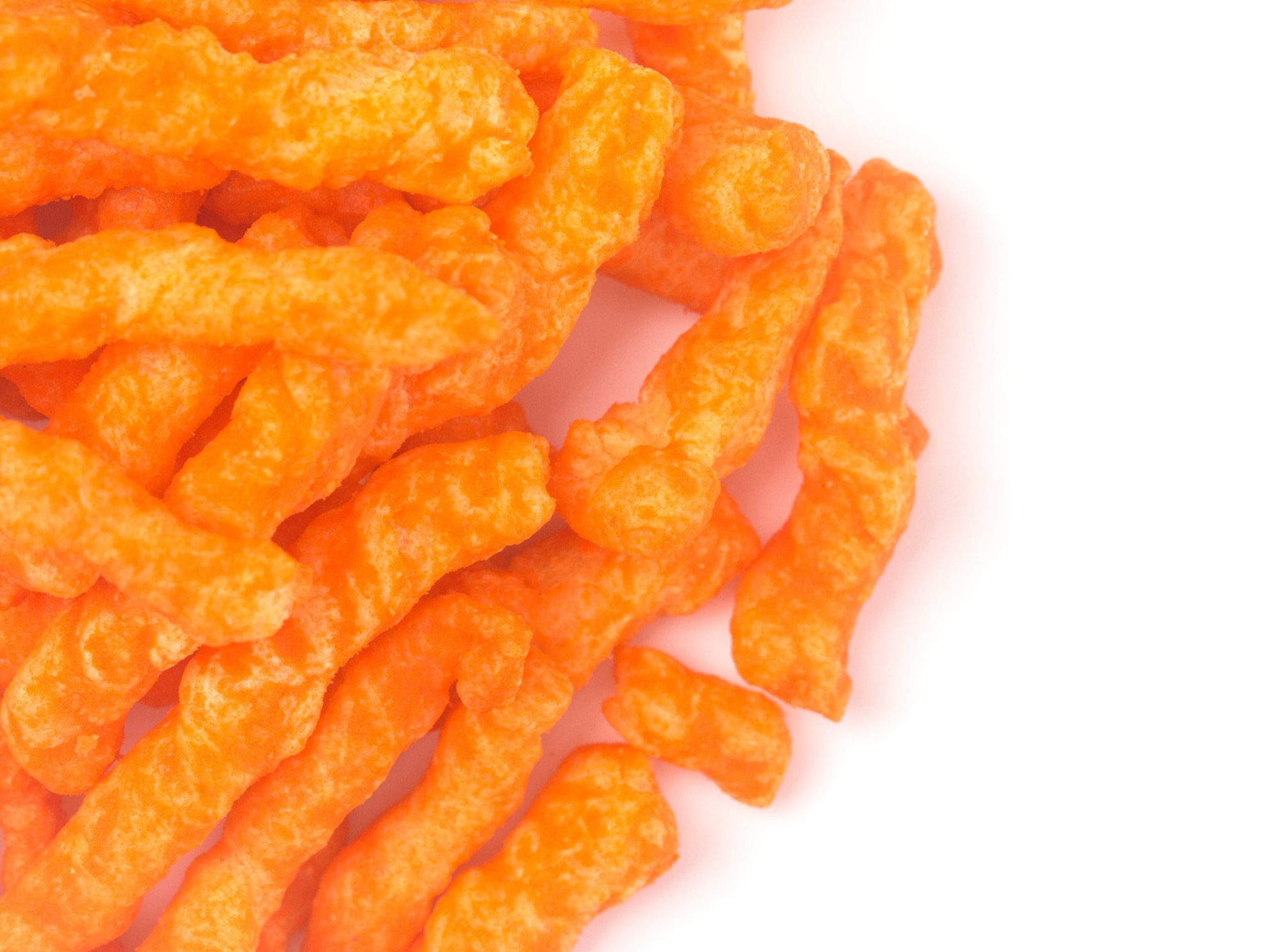 Crunchy Orange Cheesy Chips on a White Background healthy vending machines and water filtration service in Edmonton