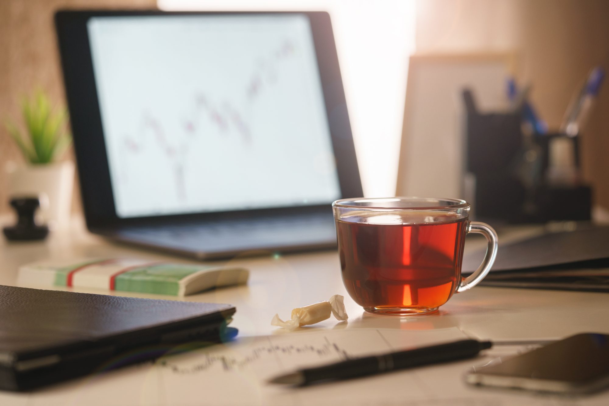 An image of a morning, office desk of a financial analyst close- Vancouver office coffee solutions and snack vending machines
