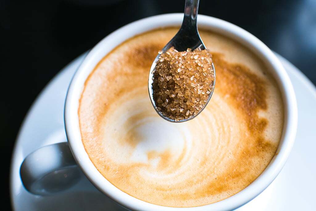 pouring brown sugar in cappuccino office coffee and beverage vending machines in Milwaukee