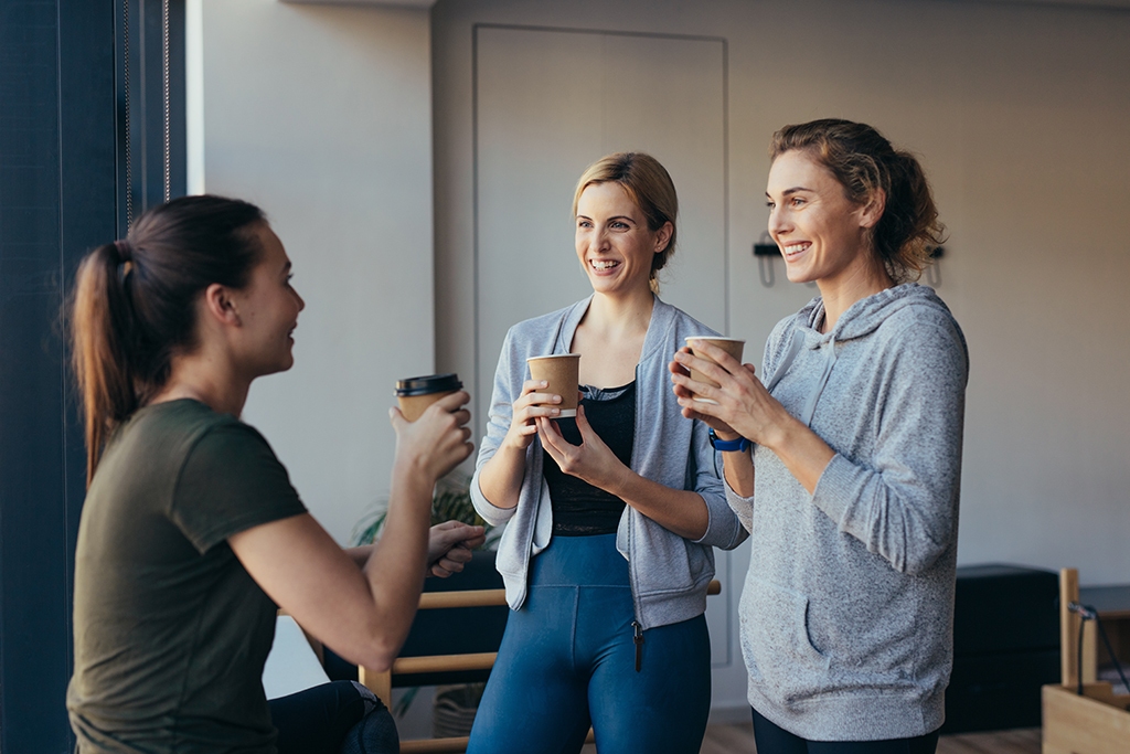 Fitness women drinking coffee after workout in a gym Tucson office coffee solutions and snack vending machines